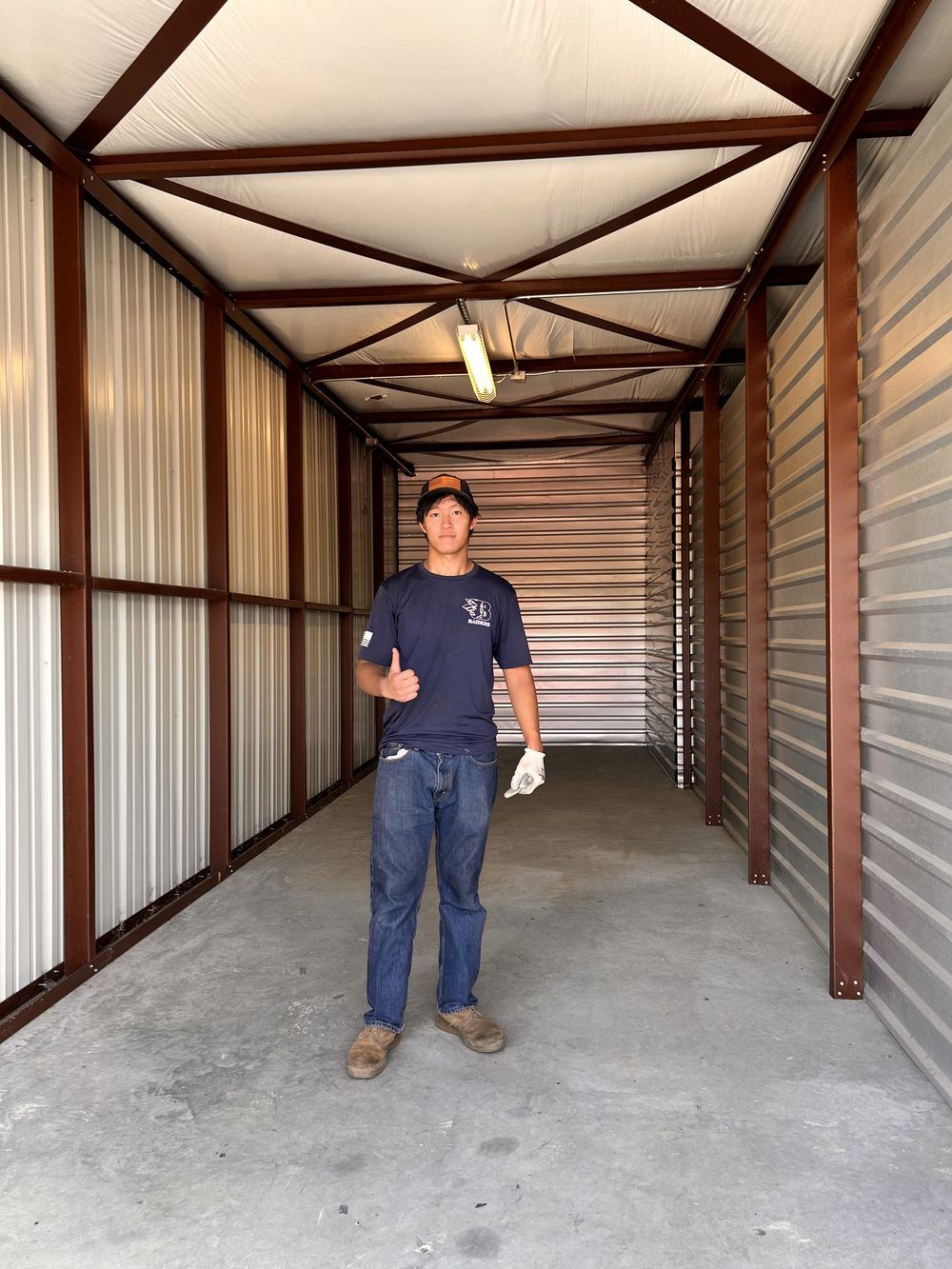 SmartStack crew in front of a neatly packed POD container